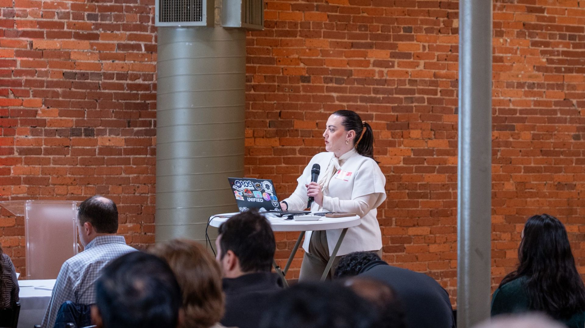 Cece Shalevska speaking at an industry event